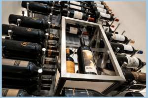 Metal Wine Racks with Modern Display Box at the Center Gving More Aesthetic Appeal to the Home Wine Cellar