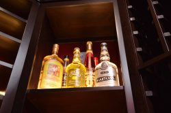 12 - Wine Bottles Displayed in Wooden Wine Racks