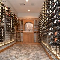 7 - Transitional Home Wine Cellar Fusing Metal and Wood Elements Impressive Closet Wine Cellar in a Modern Home